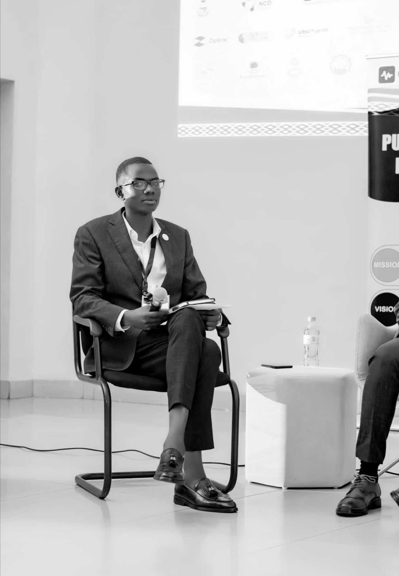 Board Chair Richard Bishumba speaking